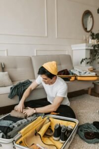 travel packing. man packing a suitcase